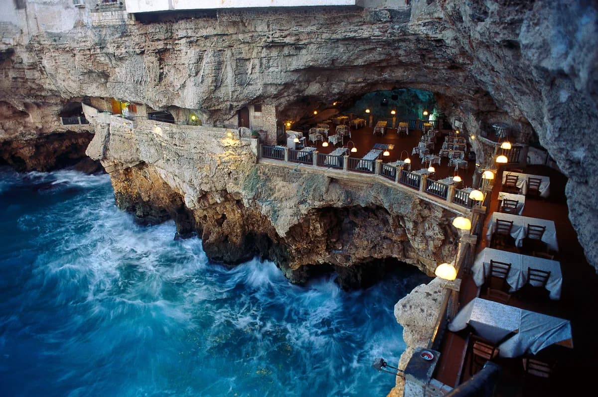 View of the restaurant in a cave in Polignano a Mare next to the sea