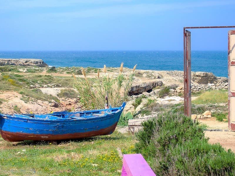 A boat and a door at Lido cala Cerasa Monopoli